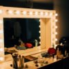 turn-on light white wooden vanity mirror